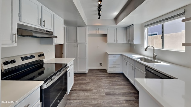 kitchen featuring sink, white cabinetry, stainless steel range with electric stovetop, wood-type flooring, and a tray ceiling