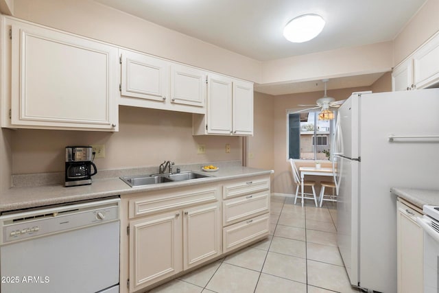 kitchen featuring light tile patterned flooring, pendant lighting, sink, white cabinets, and white appliances