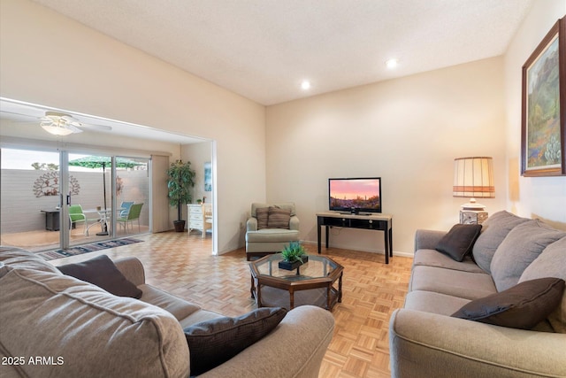 living room featuring ceiling fan and light parquet flooring