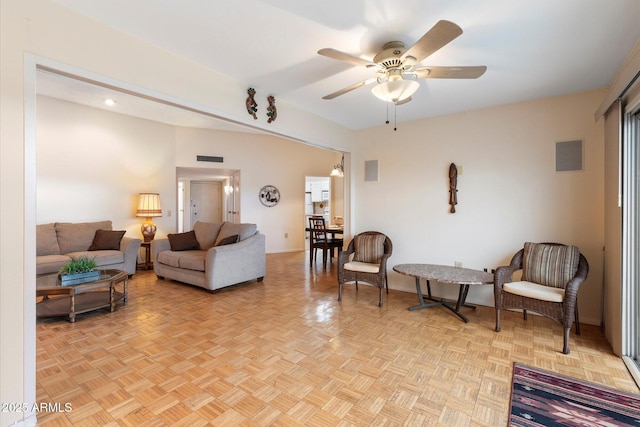 living room featuring ceiling fan and light parquet flooring