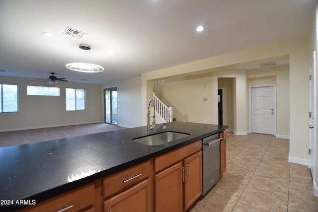 kitchen featuring sink, ceiling fan, hanging light fixtures, dishwasher, and light tile flooring