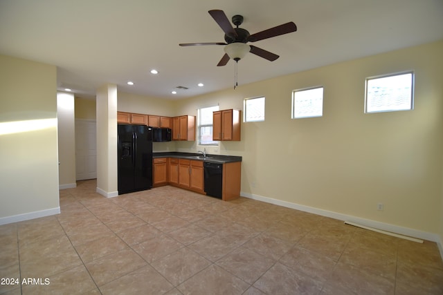 kitchen featuring light tile floors, ceiling fan, black appliances, and sink