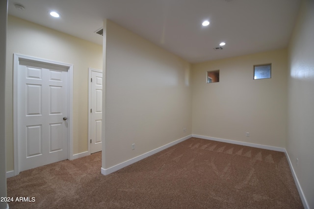 basement with dark colored carpet