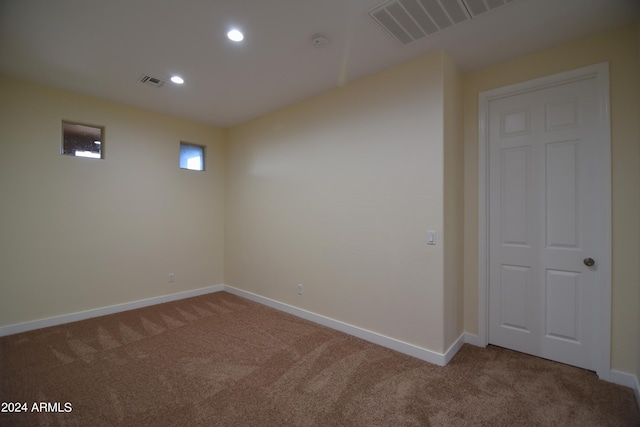 basement with dark colored carpet