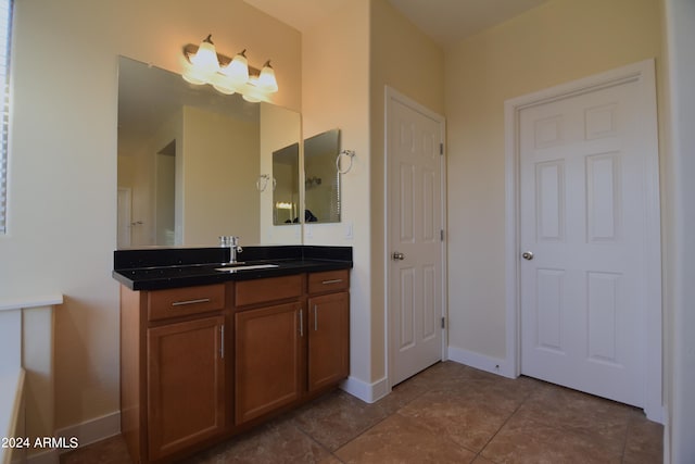 bathroom featuring tile floors and vanity