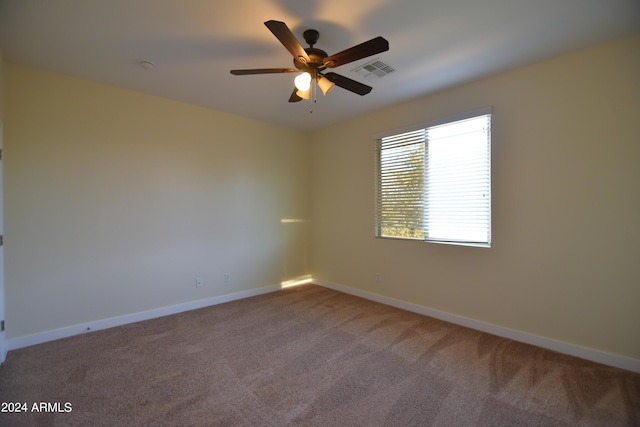 unfurnished room with carpet and ceiling fan