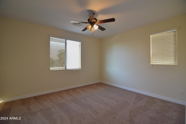 unfurnished room with ceiling fan and light colored carpet