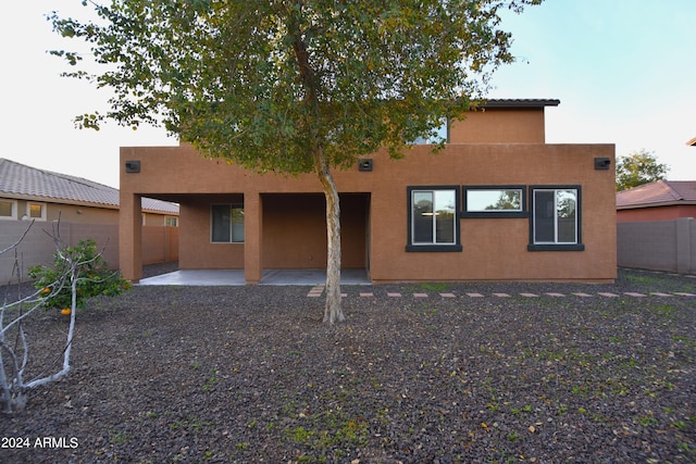 rear view of house with a patio