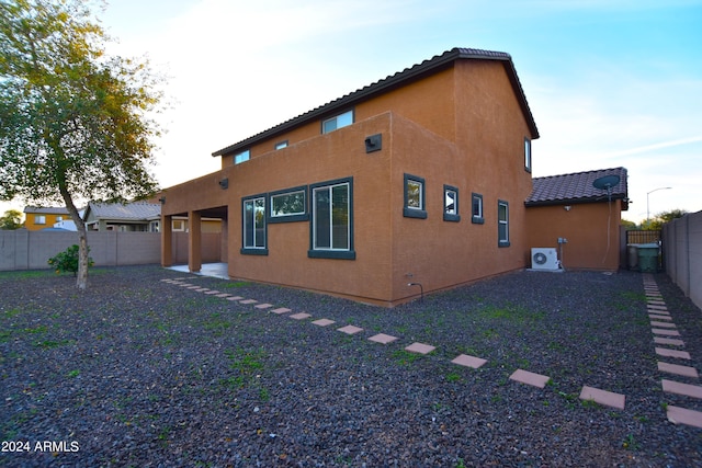 back of property with central AC unit