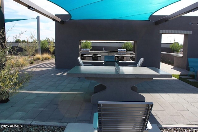 view of patio / terrace with area for grilling and an outdoor kitchen