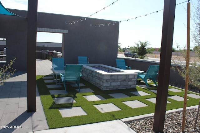 view of patio / terrace with an outdoor fire pit