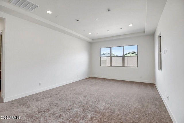 carpeted empty room with recessed lighting, visible vents, and baseboards