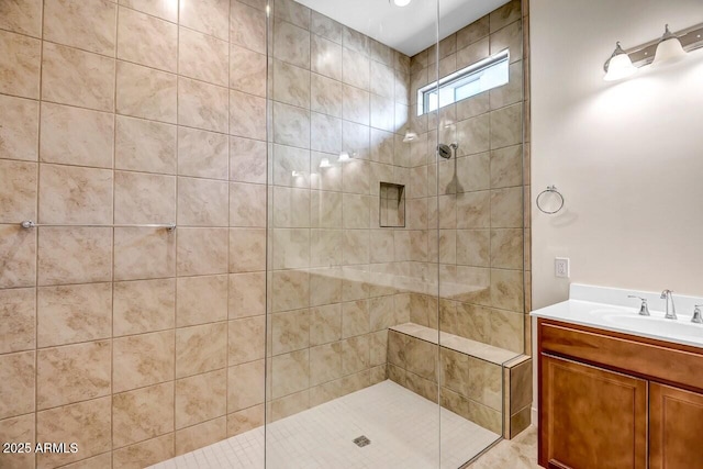 full bathroom featuring vanity and a walk in shower