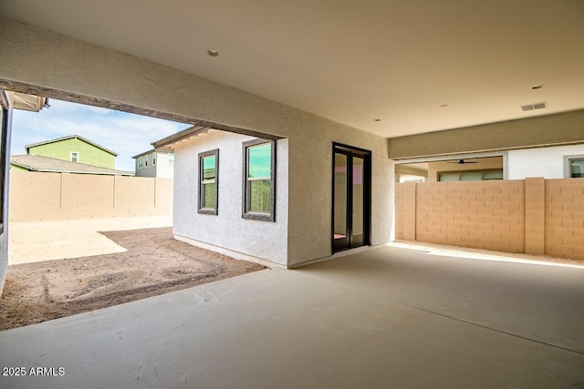 view of patio / terrace featuring visible vents and fence