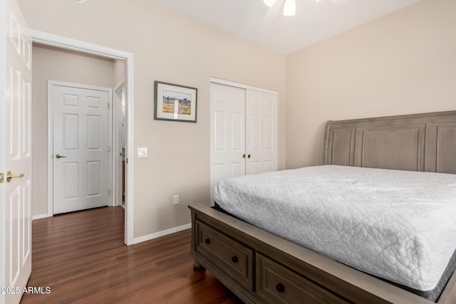 bedroom featuring dark wood-type flooring, a closet, and ceiling fan