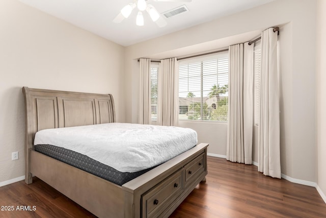 bedroom featuring dark hardwood / wood-style flooring and ceiling fan