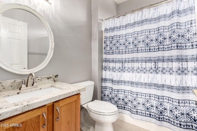 bathroom featuring a shower with curtain, vanity, and toilet