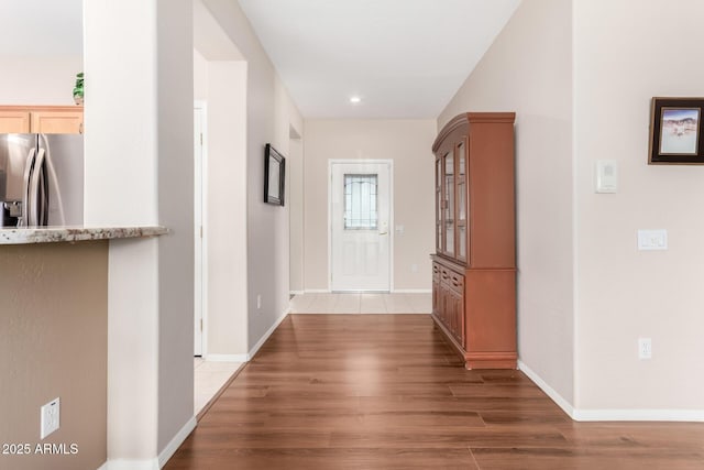 corridor with dark hardwood / wood-style floors