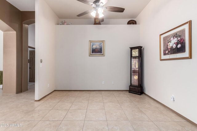 unfurnished room featuring light tile patterned flooring and ceiling fan