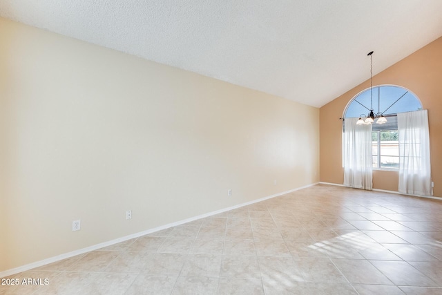 unfurnished room with vaulted ceiling, light tile patterned flooring, a notable chandelier, and a textured ceiling