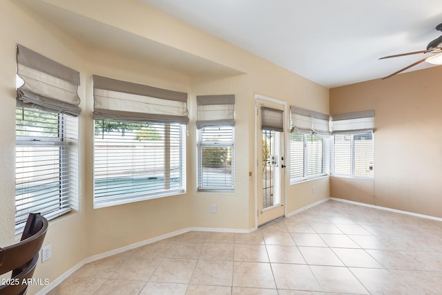 interior space with ceiling fan