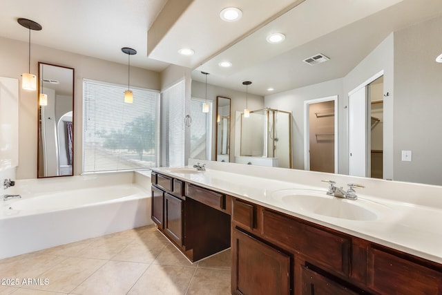 bathroom with vanity, tile patterned floors, and shower with separate bathtub