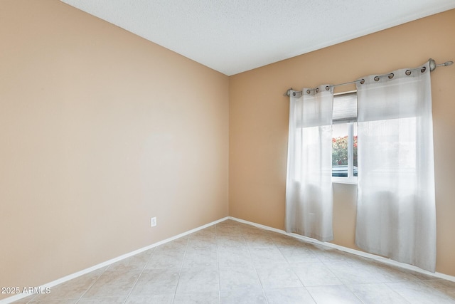 empty room with a textured ceiling