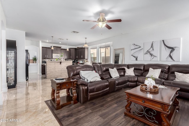 living room with ceiling fan