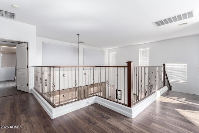 hallway featuring dark hardwood / wood-style floors