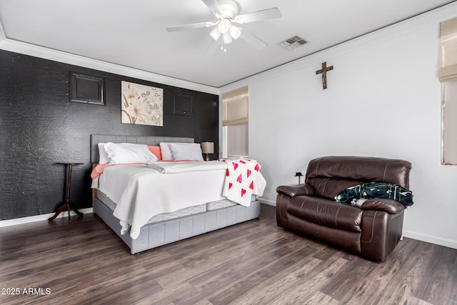 bedroom featuring dark hardwood / wood-style flooring, crown molding, and ceiling fan