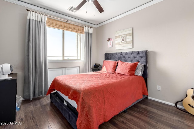 bedroom featuring crown molding, ceiling fan, and dark hardwood / wood-style flooring