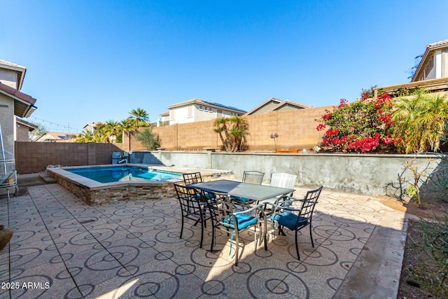 view of patio featuring a fenced in pool