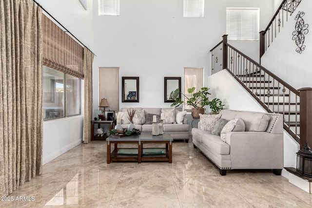 living room with a high ceiling