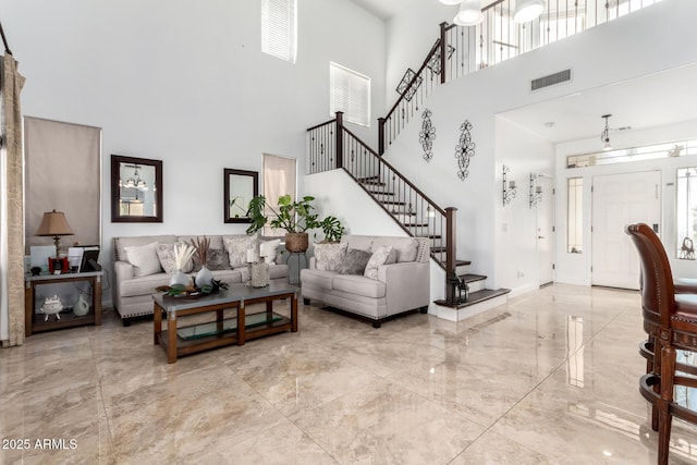 living room featuring a high ceiling