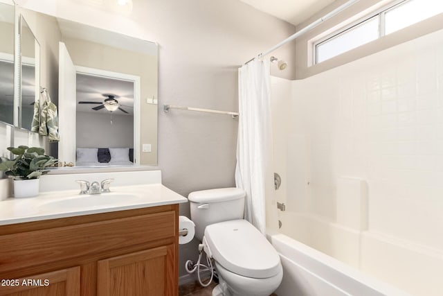 bathroom featuring toilet, vanity, and shower / tub combo with curtain