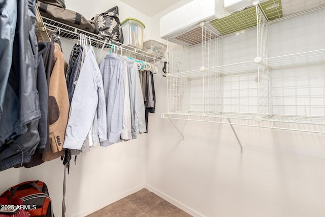 spacious closet with tile patterned floors