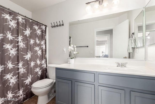 bathroom featuring vanity and toilet