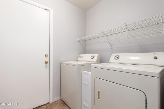 laundry room featuring laundry area and separate washer and dryer