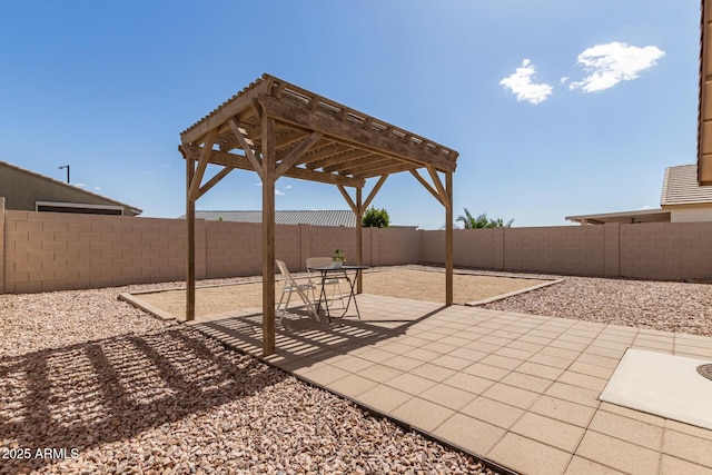 view of patio / terrace with a fenced backyard and a pergola