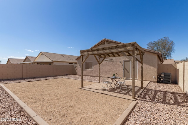 view of yard with central air condition unit, a patio area, a fenced backyard, and a pergola