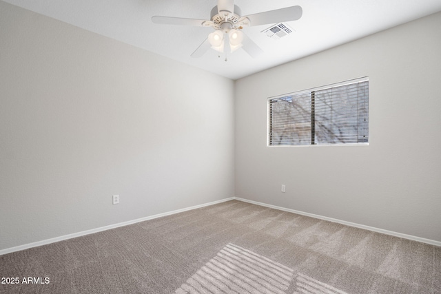 spare room with carpet floors and ceiling fan