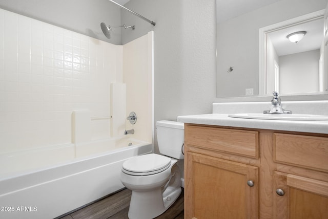 full bathroom featuring wood-type flooring, toilet, vanity, and shower / washtub combination