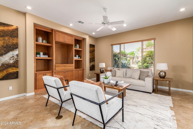 tiled living room featuring ceiling fan