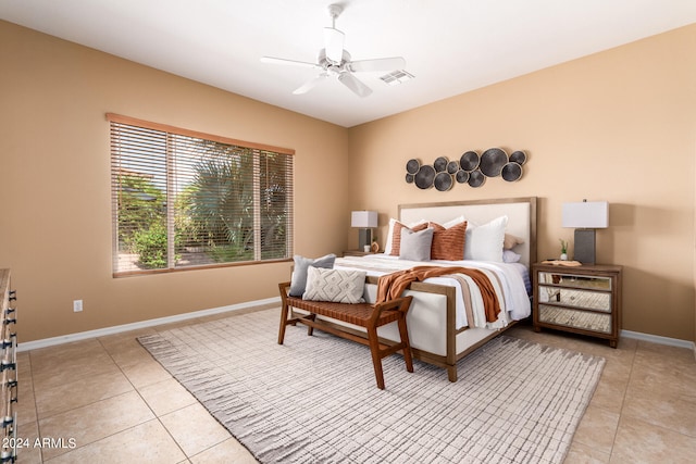 tiled bedroom with ceiling fan