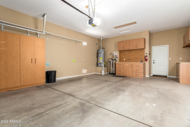 garage featuring a garage door opener and secured water heater