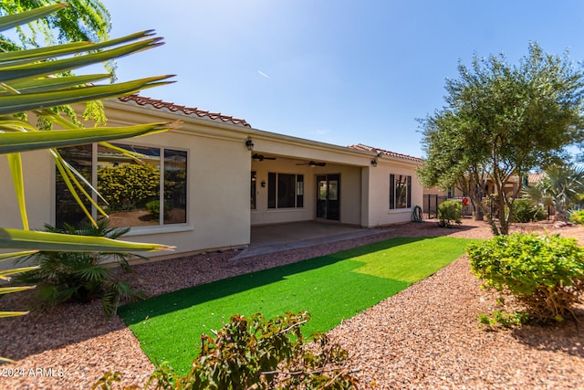 back of property featuring a patio and ceiling fan