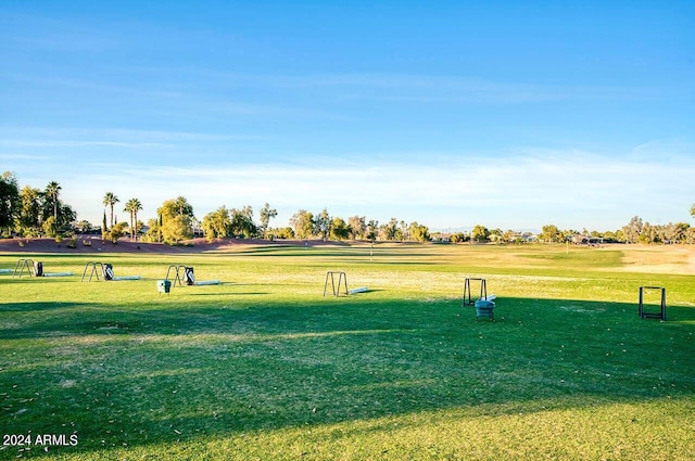 surrounding community featuring a yard