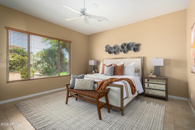 tiled bedroom with ceiling fan