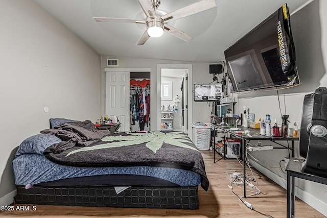 13039 N 19th Ave, Phoenix, AZ 85029 - bedroom featuring wood finished floors, a closet, and ceiling fan