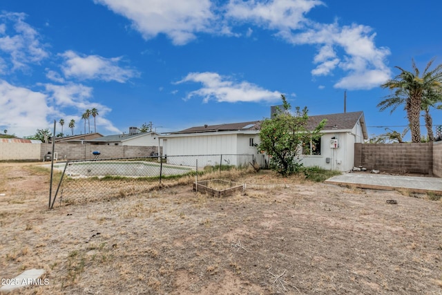 13039 N 19th Ave, Phoenix, AZ 85029 - rear view of house with solar panels and a fenced backyard